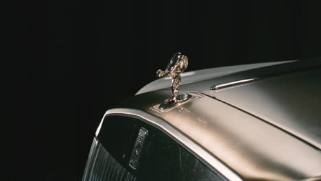 Famous-Spirit-of-Ecstasy-hood-ornament-with-Rolls-Royce-logo,-luxury-car