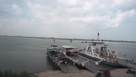 Time-lapse-of-a-small-busy-ferry-port-during-a-day-time-in-Phnom-Penh-Cambodia