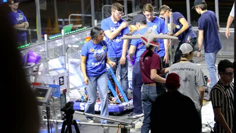 Students-placing-their-robots-on-the-playing-field-before-a-match-at-the-FIRST-Robotics