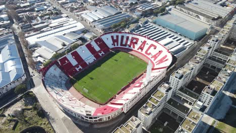 Aerial-circle-view-of-empty-stadium-in-city-area