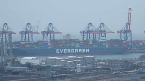 Evergreen-Container-Ship-Docked-In-The-Port-Of-Maasvlakte-On-A-Foggy-Day-In-Netherlands
