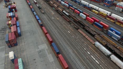 Wide-aerial-view-of-Seattle's-downtown-train-yard-sitting-with-cargo-that's-just-landed-from-abroad