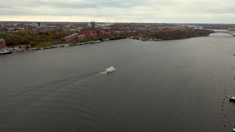 Drone-footage-of-a-boat-in-the-waters-of-Stockholm,-Sweden