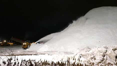 Snowplow-creating-a-massive-mound-of-snow