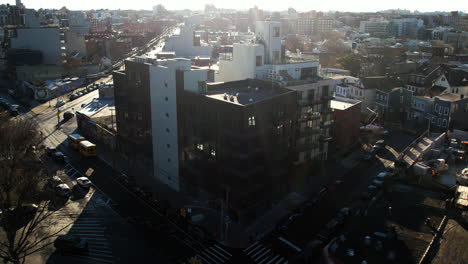 Aerial-view-toward-a-new-condominium-in-Queens,-spring-evening-in-New-York,-USA