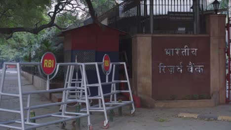 Reserve-Bank-of-India-RBI-logos-outside-of-RBI-building-at-Sansad-Marg-with-RBI-barricade