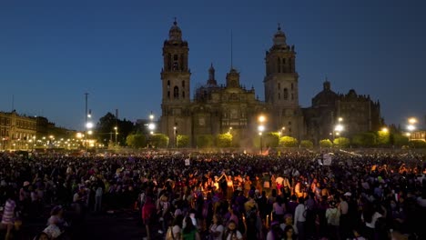 Aerial-view-of-people-protesting-on-the-Zocolo-square,-dusk-in-Mexico-city