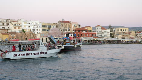 Traditional-Boat-And-Glass-Bottom-Boat-On-Tour-On-Chania's-Harbor-In-Crete,-Greece
