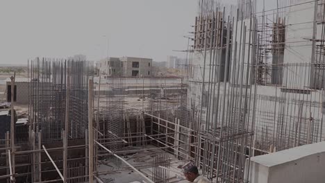 Pan-Left-View-Across-Construction-Site-In-Karachi