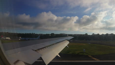 irplane-taxing-in-João-Paulo's-II-in-the-city-of-Ponta-Delgada-in-São-Migel's-island-in-the-Azores-in-the-morning-with-the-sun-on-the-background