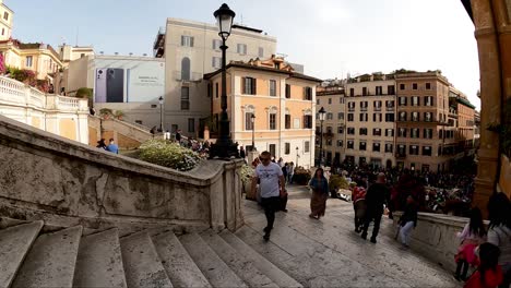 Walking-down-the-crowded-Spanish-Steps-from-top-in-Rome,-Italy