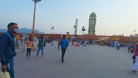 devotee-walking-at-holy-place-at-evening-from-flat-angle-video-is-taken-at-har-ki-pauri-haridwar-uttrakhand-india-on-Apr-15-2023