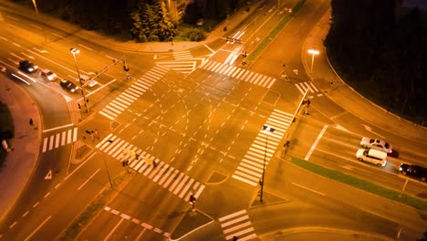 Aerial-hyper-lapse-above-a-junction-traffic-big-intersection-in-the-middle-of-city