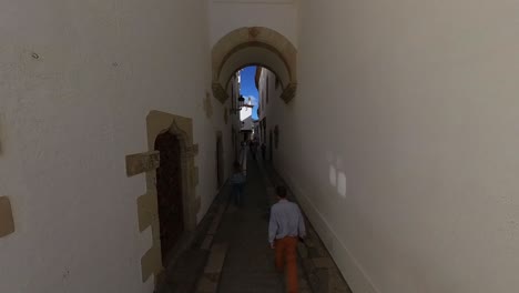 High-Angle-view-of-a-walk-down-the-narrow-Calle-de-Fonollar-in-Sitges-Spain
