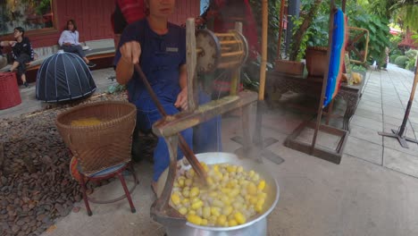 Producing-yellow-silk-by-hand-at-Jim-Thompson-House
