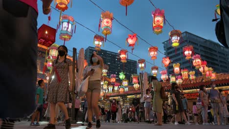 Visitors-and-tourists-attend-a-nighttime-lantern-show,-which-symbolizes-prosperity-and-good-fortune,-to-celebrate-the-Mid-Autumn-Festival,-also-called-Mooncake-Festival,-at-the-Wong-Tai-Sin-temple