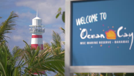 The-welcome-sign-at-Ocean-Cay,-MSC-Cruise-Lines-actual-Bahamian-island,-picturing-the-landmark-lighthouse