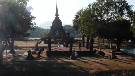 Aerial-pull-out-of-monuments-at-Sukhothai-Historical-Park-in-Thailand