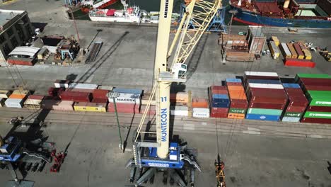 Aerial-view-looking-up-at-Montevideo-port-crane-mast-to-reveal-Uruguay-industrial-shipping-cargo-dockyard