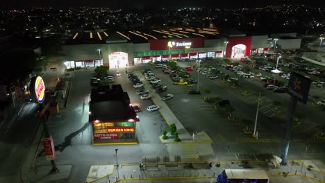 Burger-King-Restaurant-In-Front-Of-Soriana-Store-At-Night-In-Manzanillo,-Colima,-Mexico