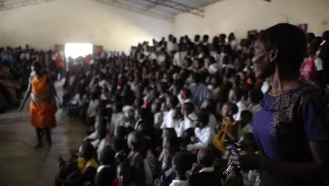 Students-walk-into-assembly-at-Sishekanu-Public-Primary-school-dancing,-Zambia