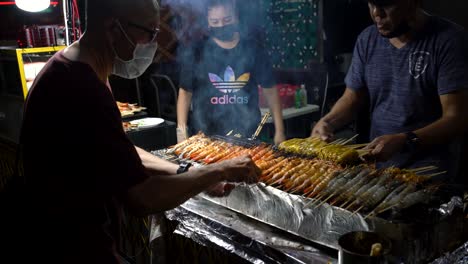 Satay-vendors-are-busily-skewing-prawns-satay-at-Lau-Pa-Sat