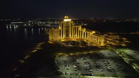 Aerial-view-toward-the-L'Auberge-Casino-and-hotel,-night-in-Lake-Charles,-Louisiana,-USA