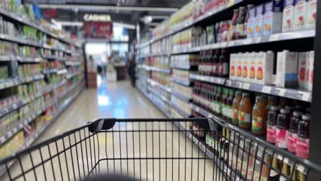 Point-of-View-Shot-inside-Shopping-cart-in-Grocery-Store-Supermarket