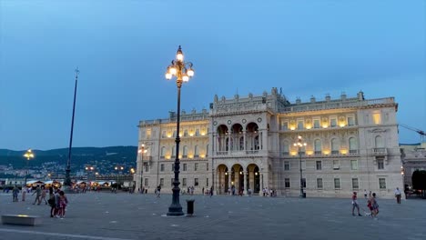 Moving-timelapse-of-the-crowded-Unity-of-Italy-Square-in-Trieste-during-twilight