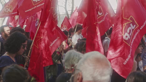 April-25th-parade-at-Avenida-da-Liberdade,-Lisbon,-detail-shot-of-Young-Portuguese-Communist-Party