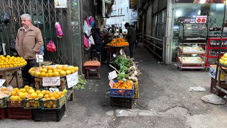 Wide-landscape-view-of-a-farmer-market-and-local-people-sell-fresh-fruits-in-a-traditional-way-in-street-shop-handicraft-stand-and-offer-sale-for-organic-product-to-make-citrus-orange-juice-cocktail