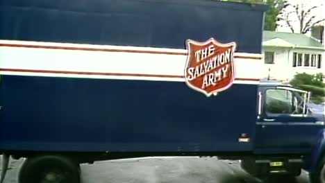 OLD-1980S-SALVATION-ARMY-TRUCK-PICKING-UP-DONATIONS