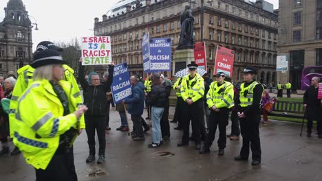 A-Pro-Palestine-supporter-next-to-a-group-of-police-officers