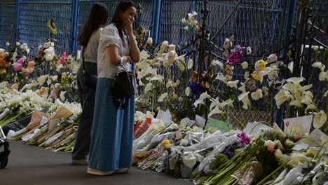 People-are-shocked-and-sad-passing-by-the-tribute-flowers-in-Belgrade,-Serbia-after-the-school-shooting