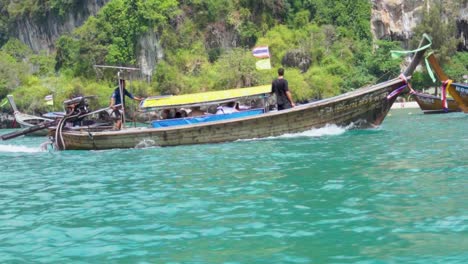 View-Of-Longtail-Motorboat-Racing-Across-Turquoise-Sea-Waters-In-Railay,-Krabi