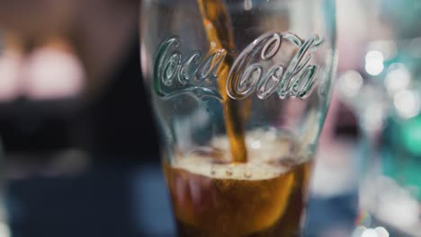 Filling-up-a-glass-of-Coca-Cola.-Slow-motion
