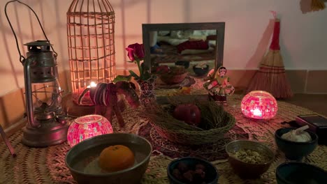 Handmade-craft-doll-and-Haftsin-Persian-culture-local-people-ritual-with-candle-apple-sumac-decoration-time-to-ravel-road-trip-accommodation-inside-a-local-people-house-in-forest-mountain-middle-east