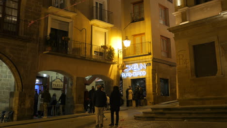 People-Enjoying-Nightlife-At-The-Bar-In-The-Town-Of-Alcaniz-In-Aragon,-Spain