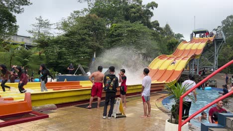 Tourist-enjoying-big-water-slide-ride-at-waterpark