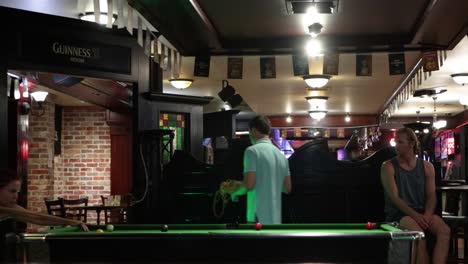 People-playing-Pool-Billiards-in-a-Bar-at-night-in-Australia