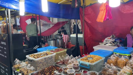 Array-of-snacks-displayed-at-the-local-Pasar-Malam-in-Jalan-Tuanku-Abdul-Rahman,-Kuala-Lumpur,-Malaysia