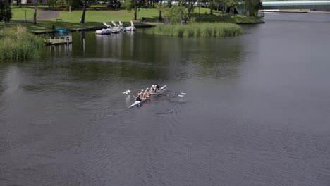 Group-of-People-Rowing-a-Row-Boat-in-the-River-Torrens-Adelaide-South-Australia
