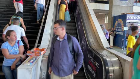 People-are-using-the-escalator-inside-of-a-shopping-mall