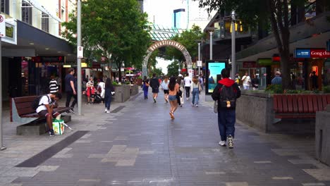 Walk-through-shot-capturing-busy-Queen-Street-Mall,-popular-pedestrian-shopping-precinct-in-downtown-Brisbane-city,-central-business-district,-Queensland,-Australia