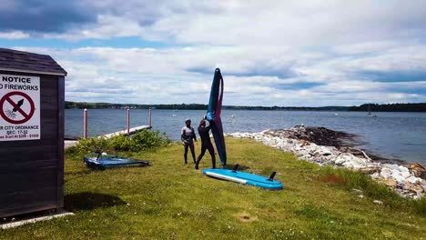 Instructor-teaching-student-how-to-windsurf-in-Portland,-Maine