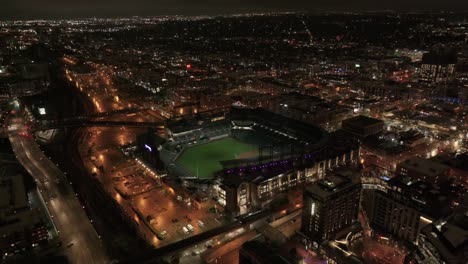 High-aerial-establishing-shot-of-Colorado-Rockies-MLB-stadium-at-night
