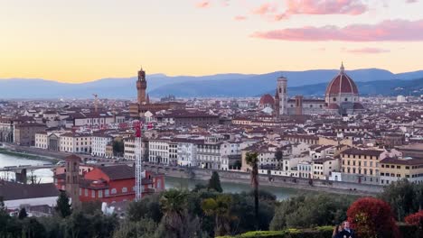 Panning-shot-of-Florence-from-Piazzale-Michelangelo-at-sunset-with-pink-clouds