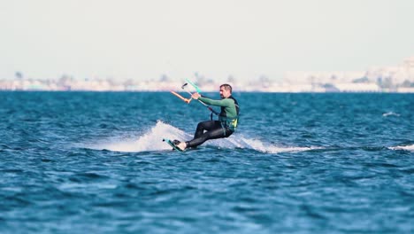 Murcia,-Spain,-April-10,-2023:-Sportsman-practicing-hydrofiol-kite-surf-on-a-windy-day-at-the-Spanish-coasts