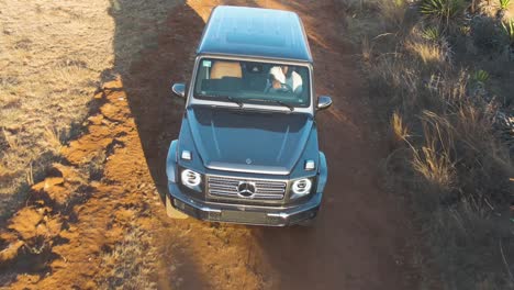 Off-road-Mercedes-Benz-car-driving-through-desert-in-Oaxaca,-Mexico