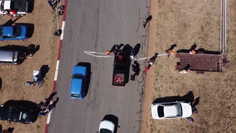 Drone-video-of-car-art-at-a-drag-race-competition-in-Bulawayo,-Zimbabwe